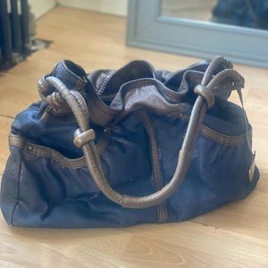 Stuart Weitzman purse. Jeans w sparkles . Leather bronze .